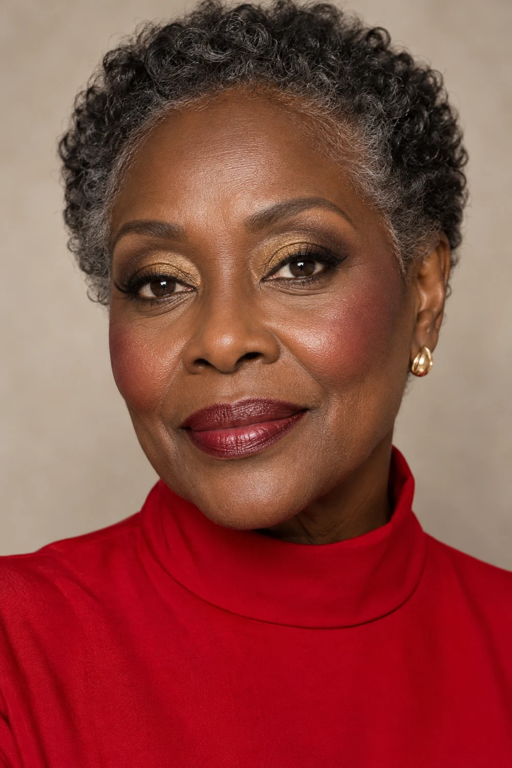 Close beauty portrait of a fictional mature Black woman in a high-neck red dress, wearing gold and taupe eye makeup, espresso liner, berry-rose blush, and a wine-toned satin lip.