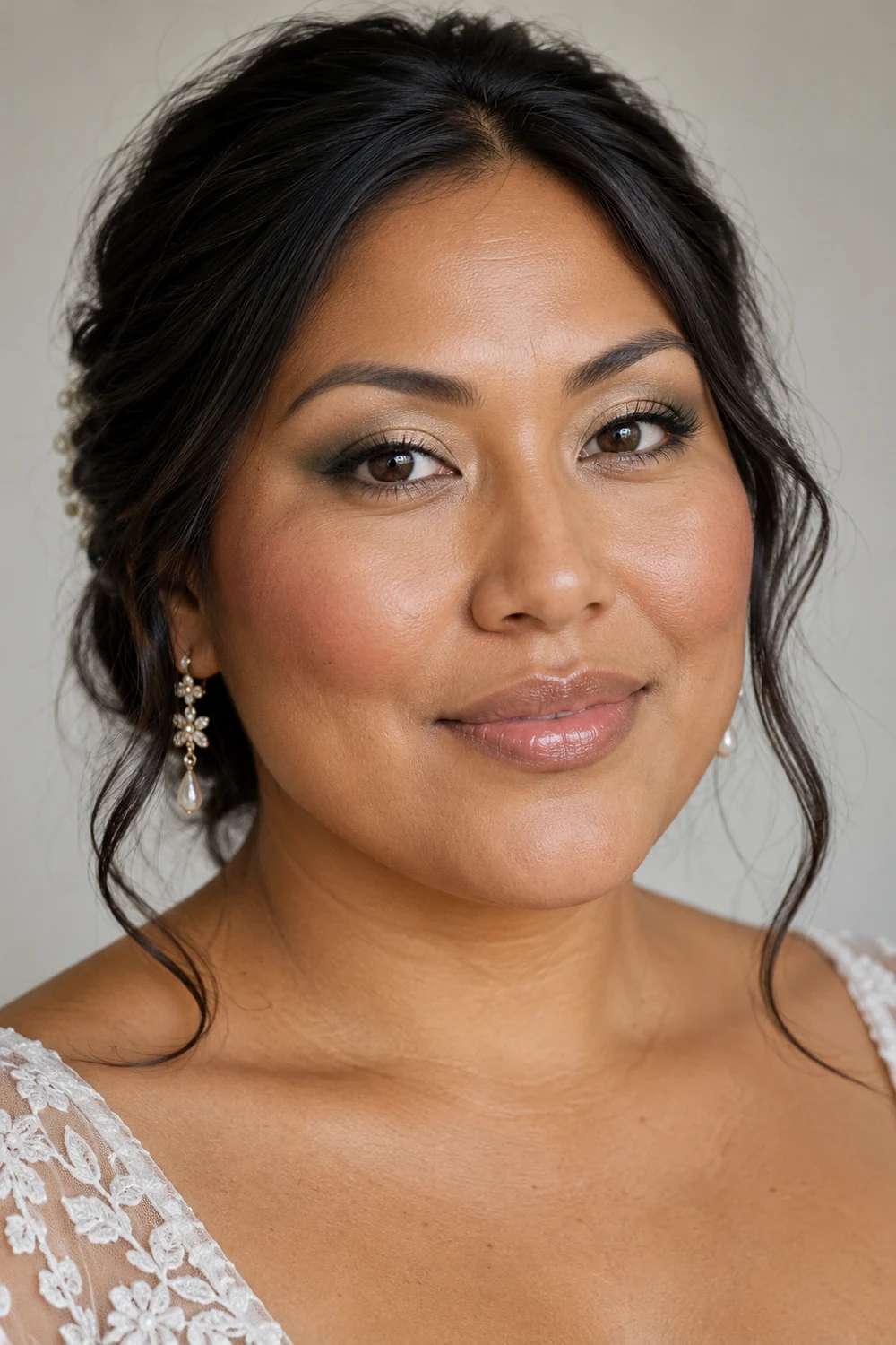 Fictional adult woman with copper-brown skin, muted sage outer-lid shadow, champagne-beige lid centers, short brown liner, softly blended pink-brown blush, and translucent nude gloss.