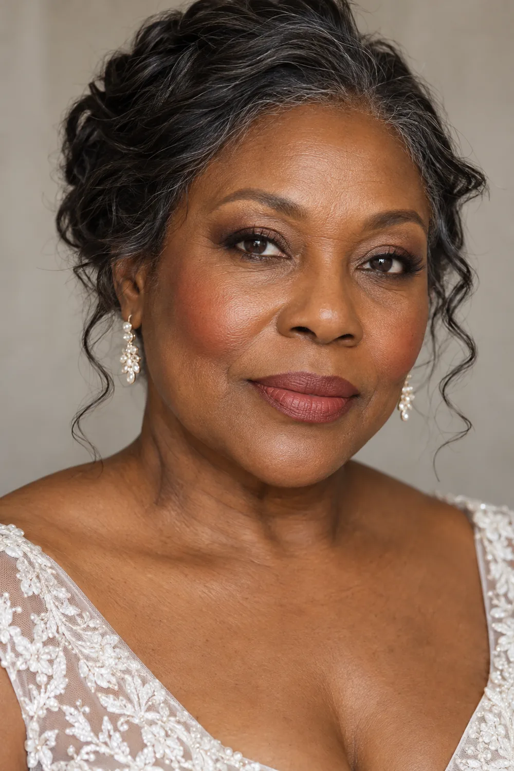 Fictional mature Black woman in bridal-inspired attire with softly smudged brown lash edges, brick rose blush, and a muted rose lip.